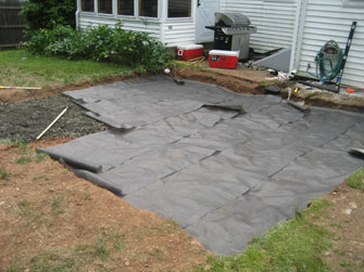 putting landscape tarp over the patio